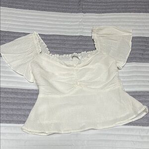ASTR Ivory Peplum Top